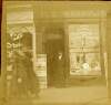 [Thomas J. Clarke, full length portrait of him standing outside his shop 75 A, Parnell Street, Dublin]