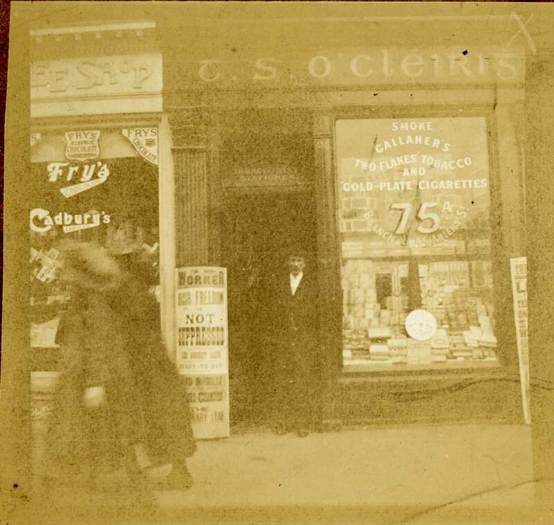 [Thomas J. Clarke, full length portrait of him standing outside his shop 75 A, Parnell Street, Dublin]