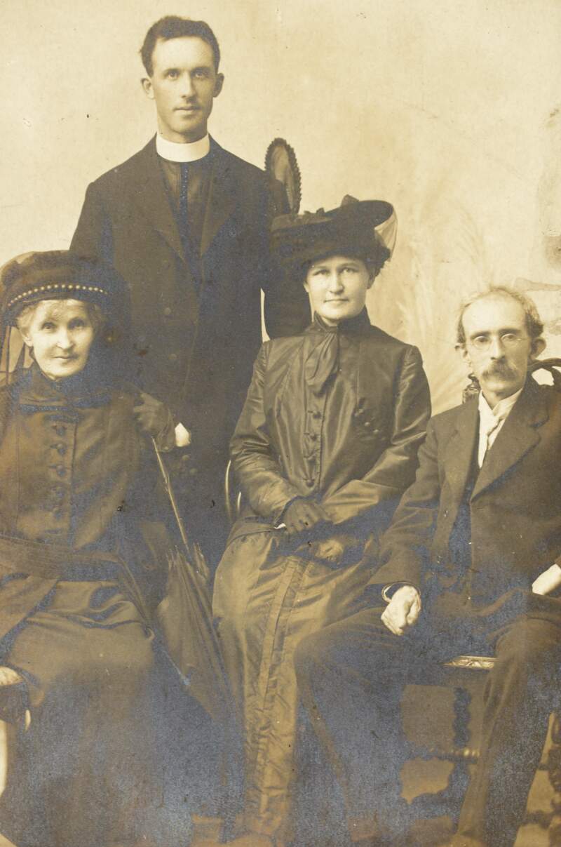 [Studio portrait of Thomas Clarke, seated, with Mrs. Mary O'Donovan Rossa, Eileen O'Donovan Rossa and Fr. Michael O'Flanagan]