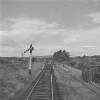 Signal post, signal box in distance, Crossbarry, Co. Cork.