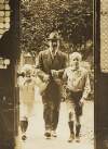 [Arthur Griffith entering his home with his two children]