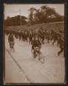 [Armed Irish Volunteers marching and cycling on a road during the Howth gunrunning]