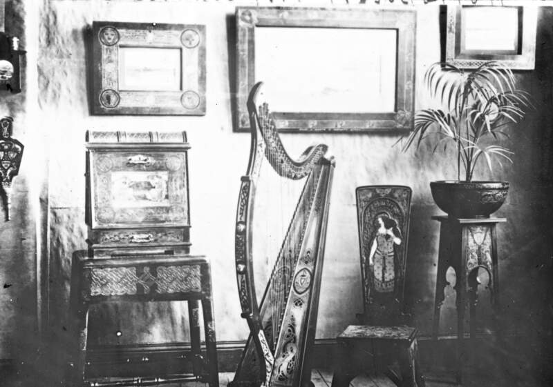 15 Garfield Chambers Belfast. Chairs, plant stand, harp, mirror. Distinctive Irish celtic design work.