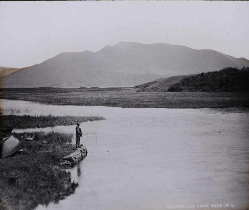 Intrinsic Bay, Kilkee, man fishing.