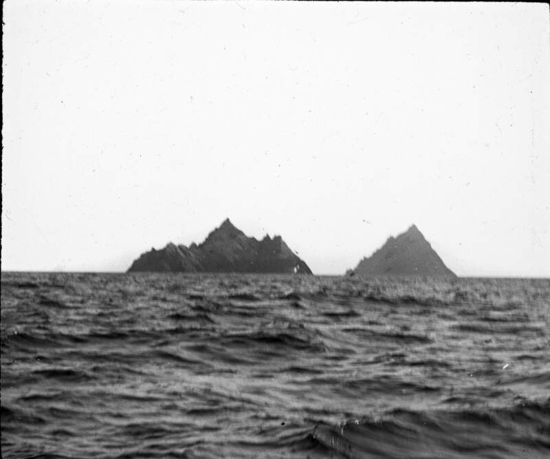 The Skelligs, from a distance, across sea.