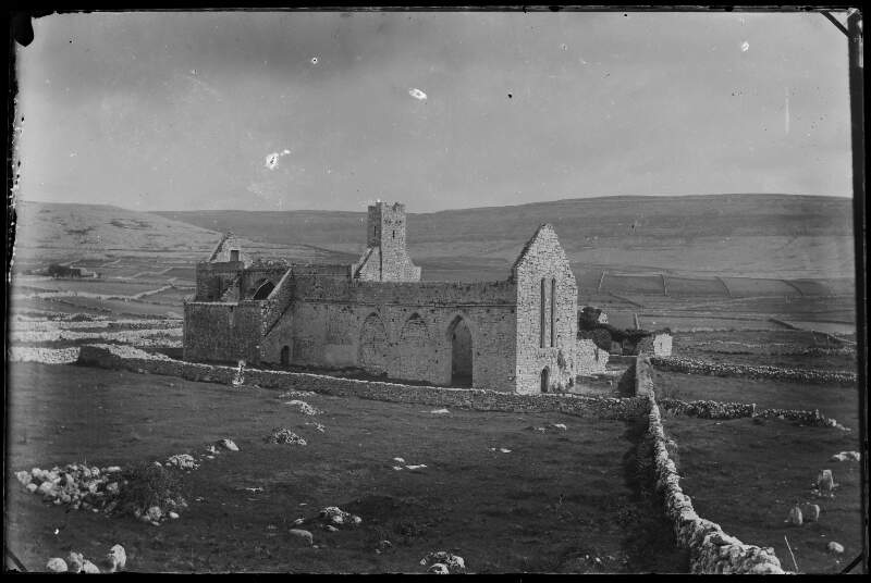 [View of Corcomroe Abbey Church and surrounding stone-walled fields, North Clare.]