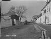 [A horse and cart on a street in Ahascragh.]