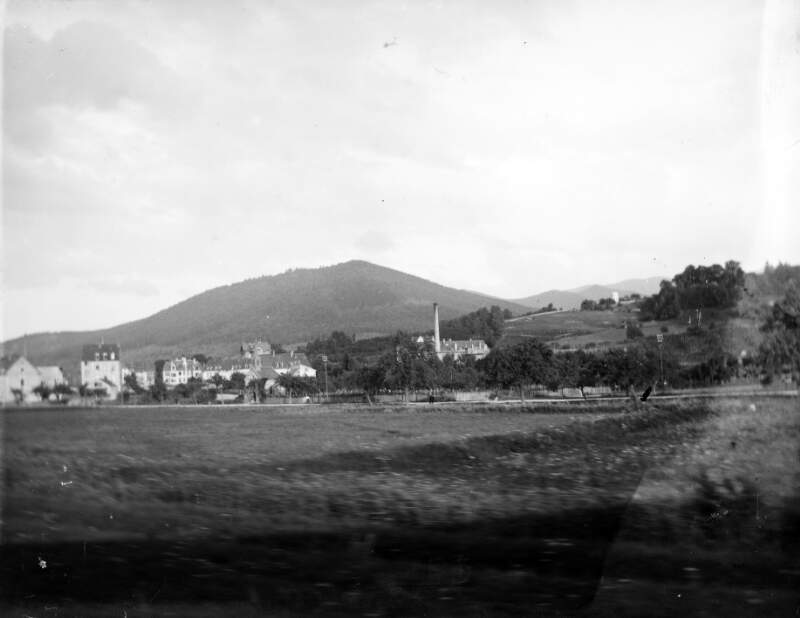 [Distant view of village and rural area.]