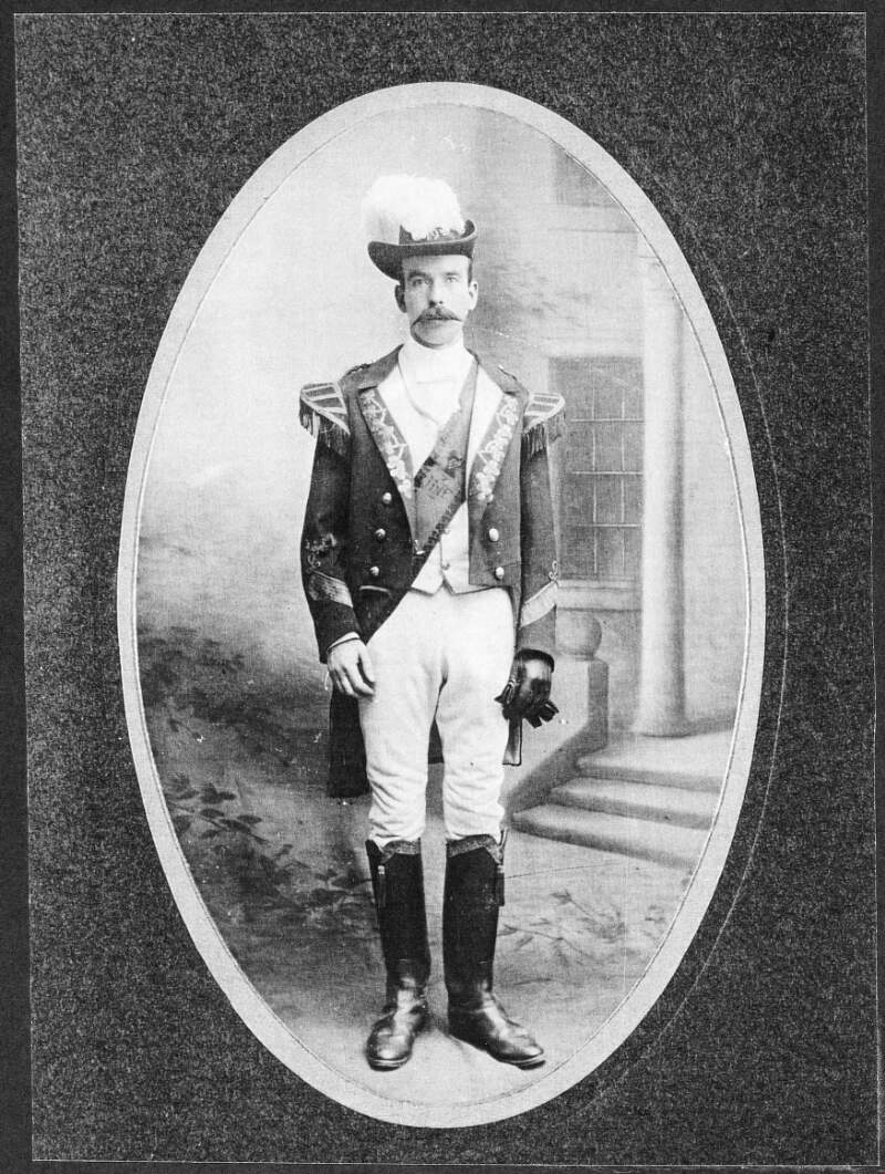 [Full length portrait of unknown member of the Irish National Foresters, in ceremonial uniform]