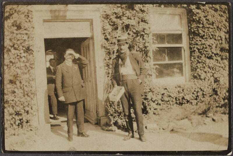 [Arthur Griffith, standing in a doorway],