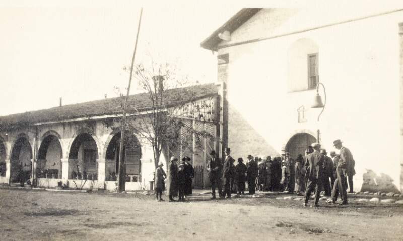 [Group of people outside the Santa Inés Mission, Solvang, California, to honour the memory of Father Albert OSFC]