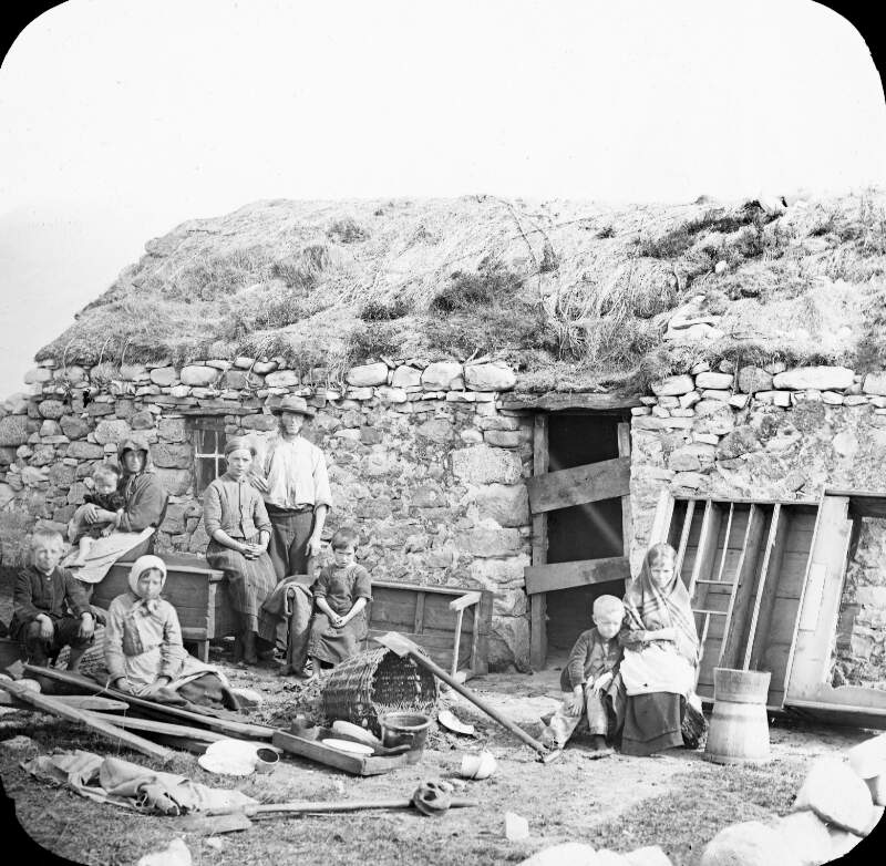 Eviction - 7 figures, plus goods in front of hut, Co. Donegal.