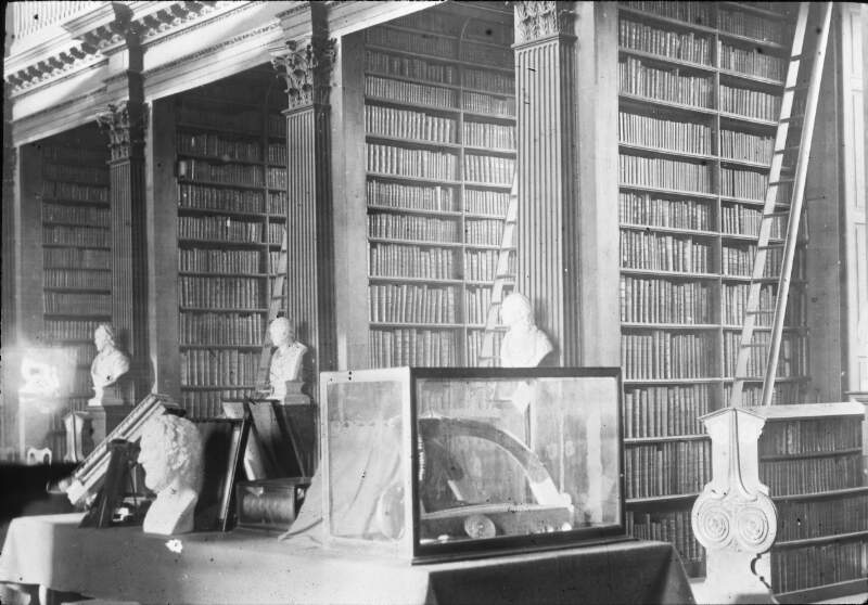 Interior of Library, with display cases: Mss and harp in case.