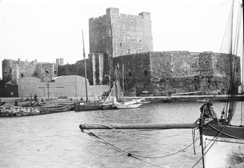 Carrickfergus Castle. Warehouse at shore: W. Gorman & Son.