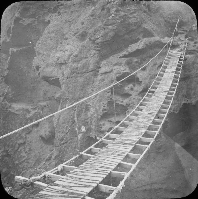 Rope bridge, detail of construction across ravine/chasm.