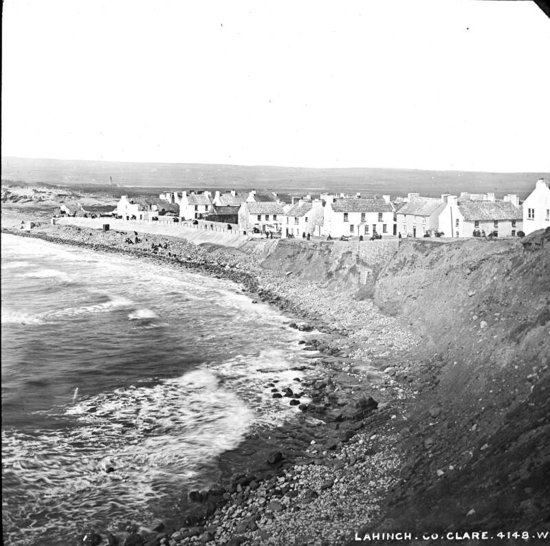 Lahinch, County Clare. At shore, figures in distant shot.