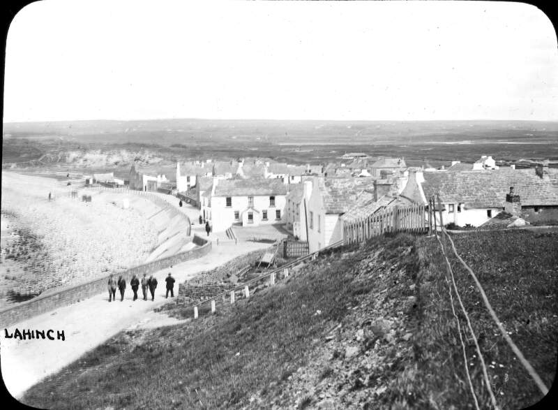 Lahinch, County Clare. Promenade, line across of five men walking.