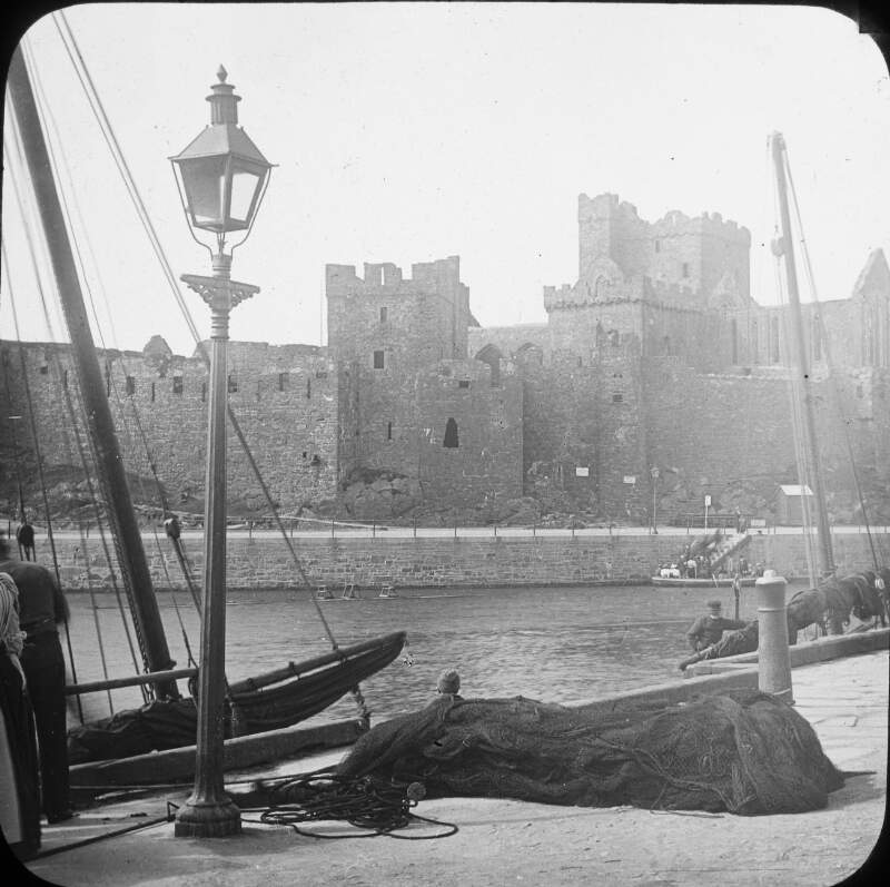 Castle, harbour and fishing nets drying.