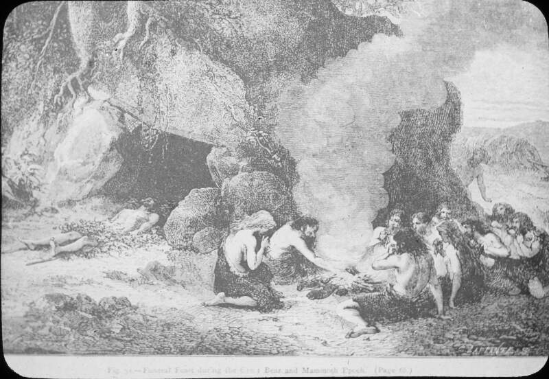 Cave, with body lying at mouth of same. Men/women wearing skins, by fire.
