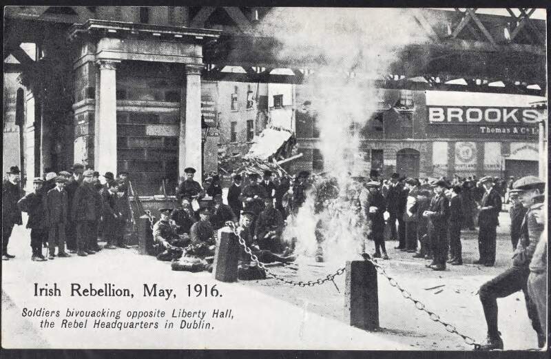 [Postcard] Irish Rebellion, May, 1916 : soldiers bivouacking opposite Liberty Hall, the rebel headquarters in Dublin.