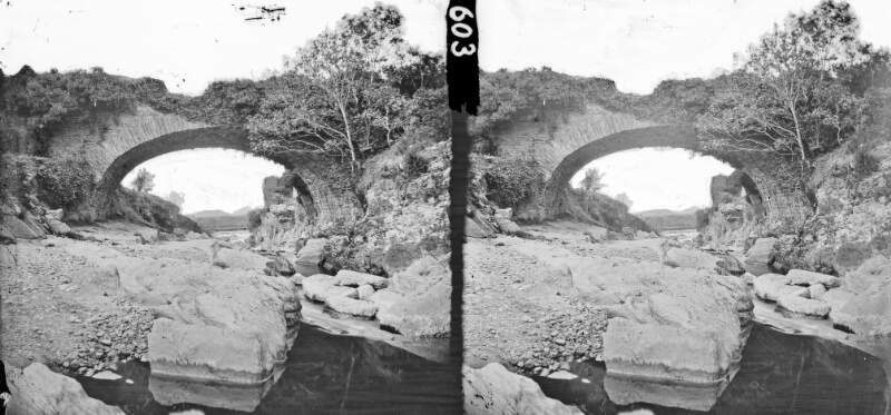 Long shot, bridge over rock-strewn stream
