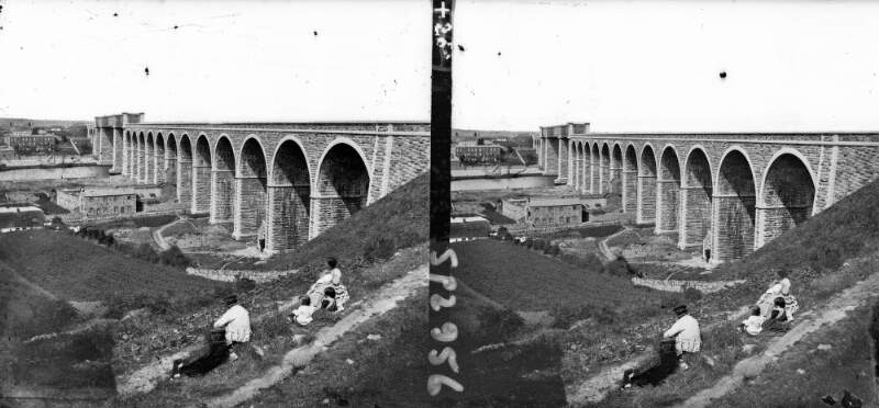 Railway viaduct, people on enbankment in foreground, Drogheda, Co. Louth