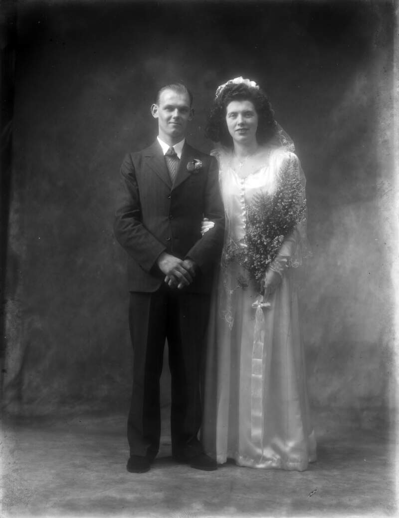 Mr. and Mrs. W. Smyth, 41, Michael Street, Waterford, full length wedding portrait, both standing