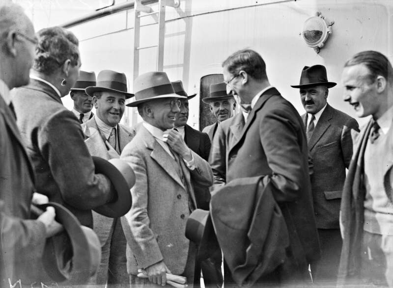 Mr. De Valera being greeted by members of the Government