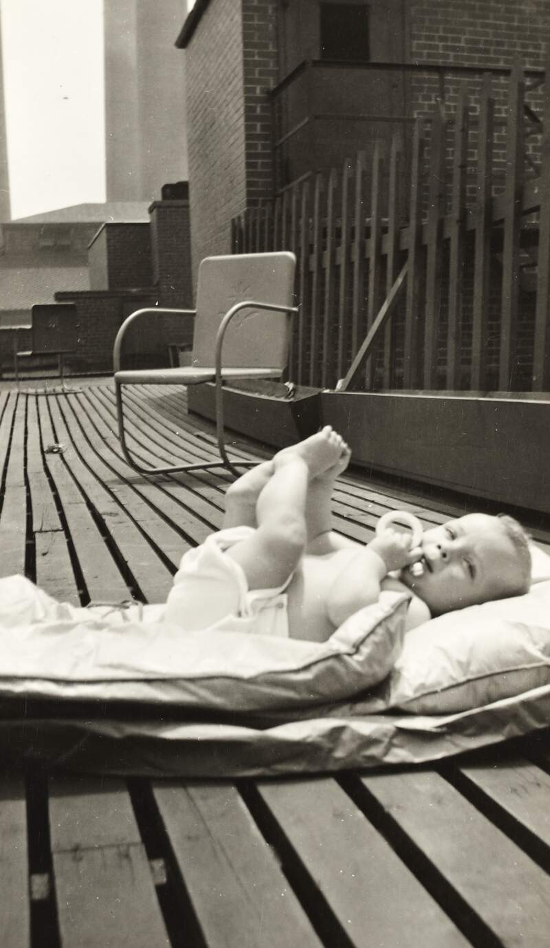[Billie Carson, at six months, lying on mattress]