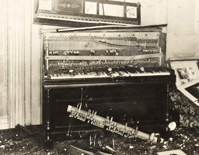 [Damaged piano at Áine Ceannt's home on Oakley Road following a raid by Free State forces]