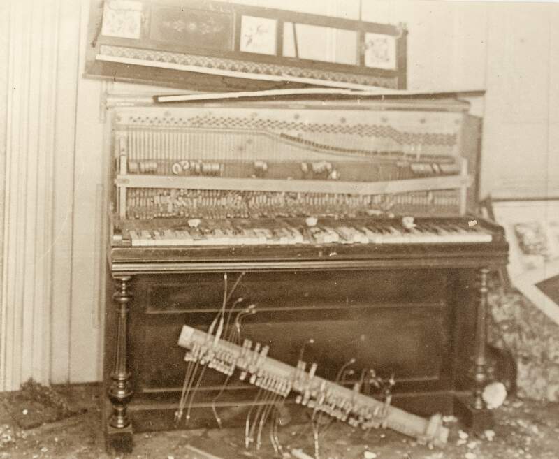 [Damaged piano at Áine Ceannt's home on Oakley Road following a raid by Free State forces]