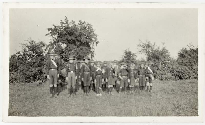 [Unidentified children in uniform, standing to attention, full-length, front facing portrait]