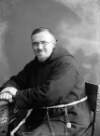 [Fr. Senan, half-length seated portrait, facing forward]