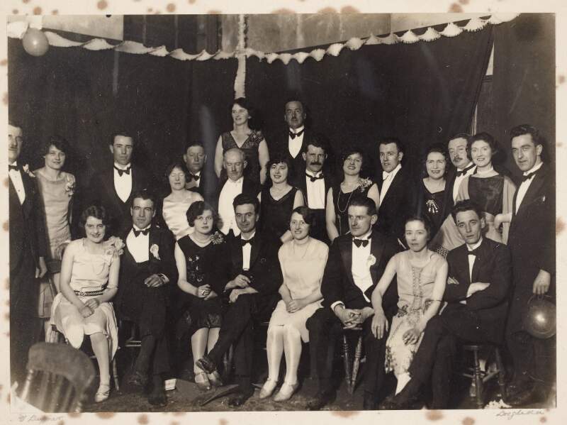 [People in evening dress attending a party]