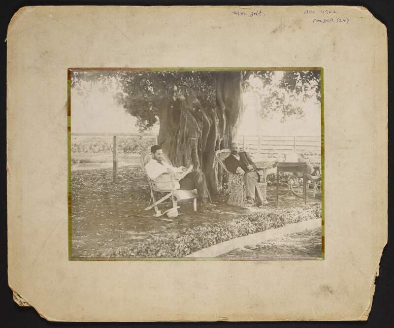 Studio portrait of Roger Casement and unidentified man seated in garden,