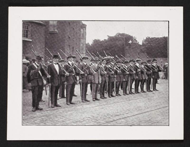 [Armed group of Irish Volunteers standing to attention]