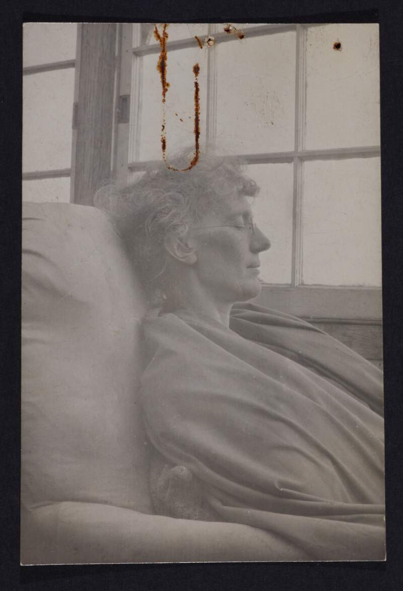 [Eva Gore-Booth, seated at window with eyes closed, head and shoulder portrait, facing sideways]