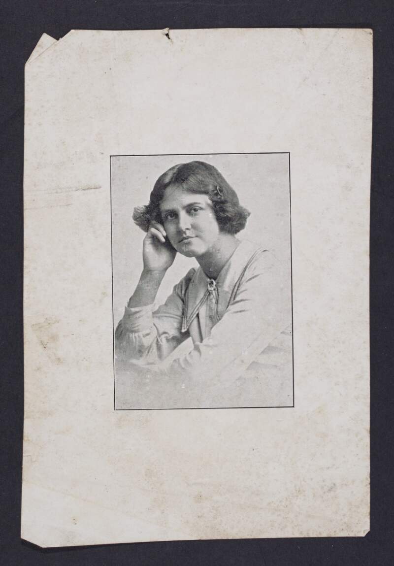 [Half-length seated portrait of young woman in white dress with short hair]