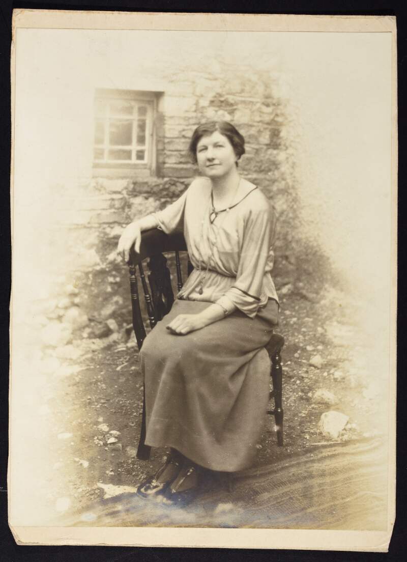 [Mary J. Curley, full length seated portrait]