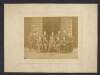 [George Coffey and others, in graduation robes, seated portrait]