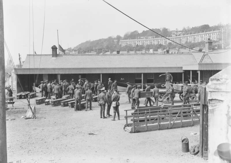 [Lusitania disaster, Cobh, Co. Cork : soldiers lifting coffins on to carts]