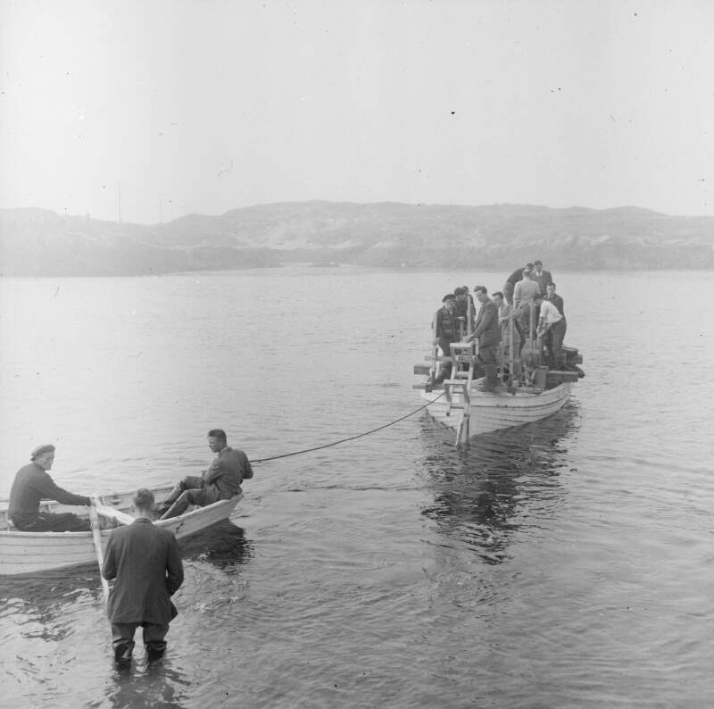 [Men in a fishing boat laying a submarine cable to Arranmore Island, Co. Donegal]