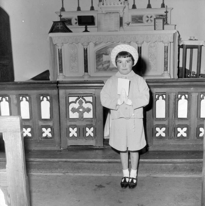 [Girl at a church altar for communion, Arranmore, Co. Donegal]