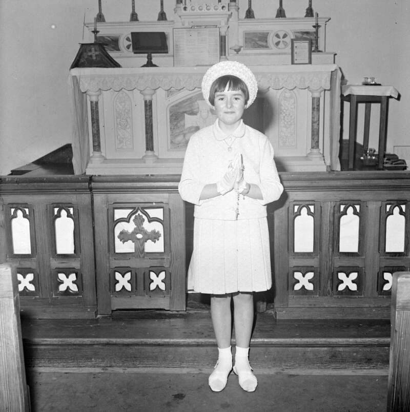 [Girl at church altar for communion, Arranmore, Co. Donegal]