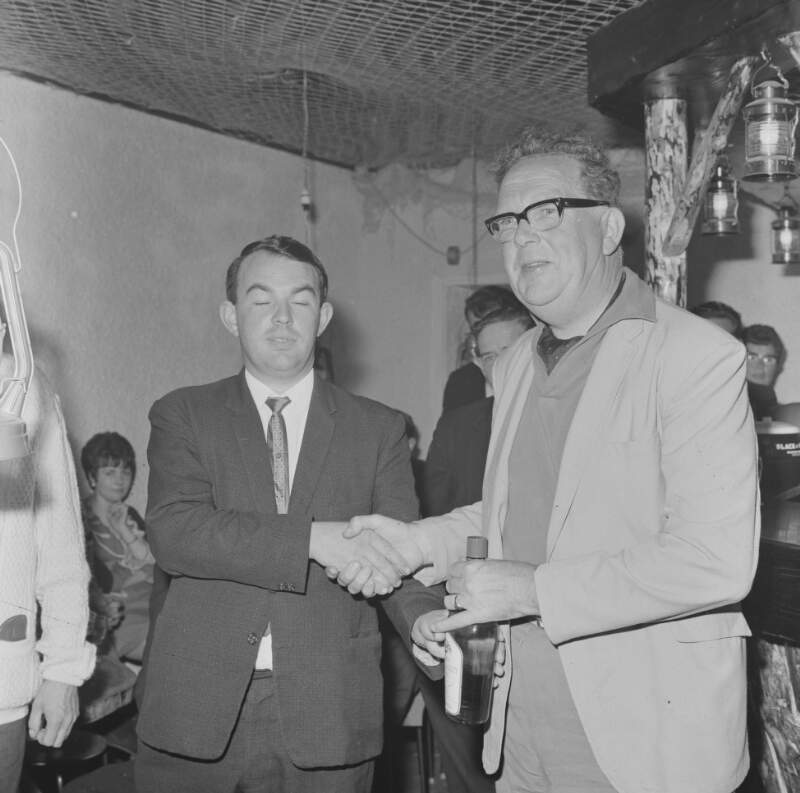[Man being presented with award, Burtonport, Co. Donegal]