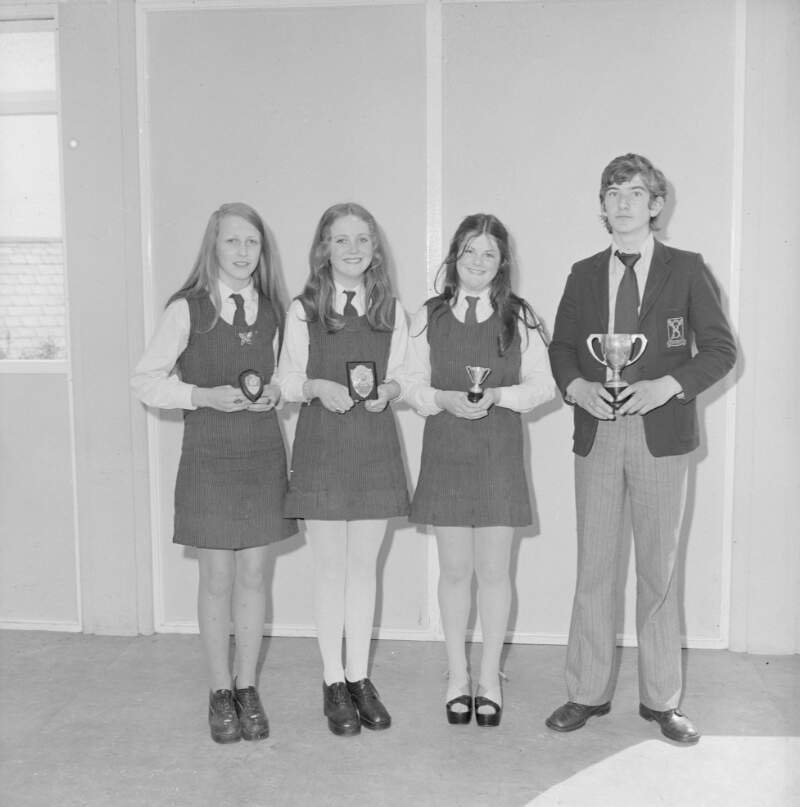 [Group of pupils with trophies and medals inside Scoil Mhuire's secondary school, Derrybeg, Co. Donegal]