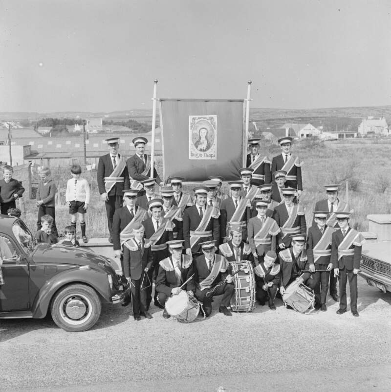 [Marching band, with banner, at the Easter Parade in Dungloe, Co. Donegal]