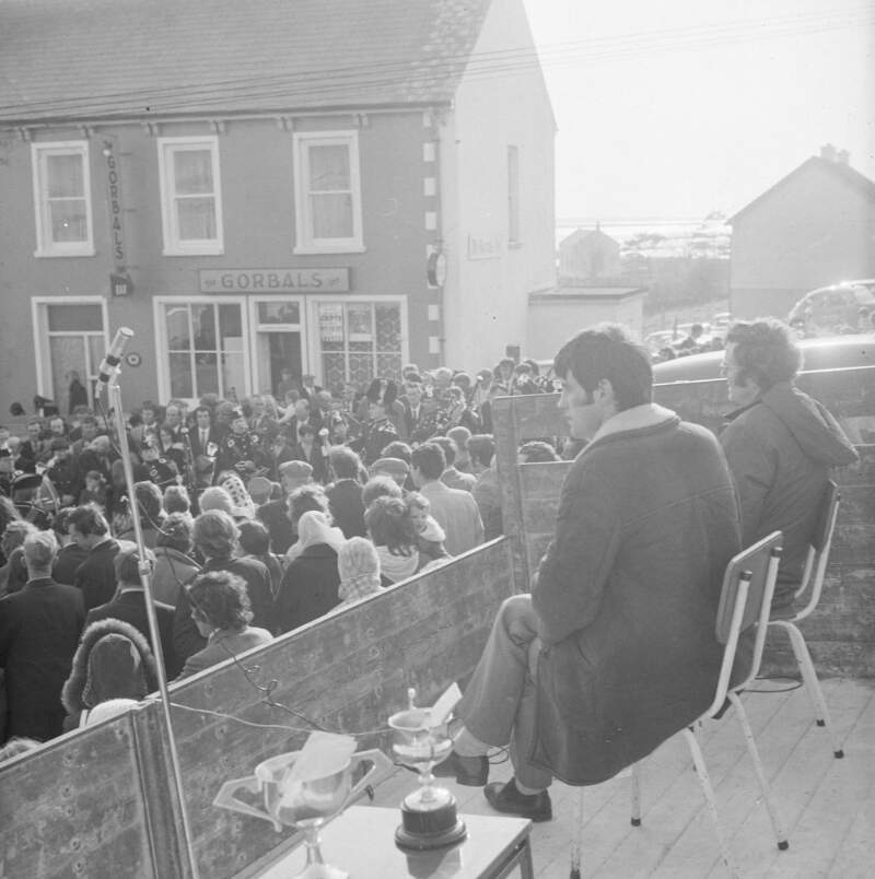[Marching band and crowd at the Easter Parade in Dungloe, Co. Donegal]