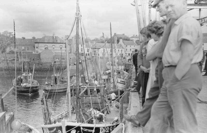 [Anglers beside fishing boats at Killybegs harbour, Donegal]