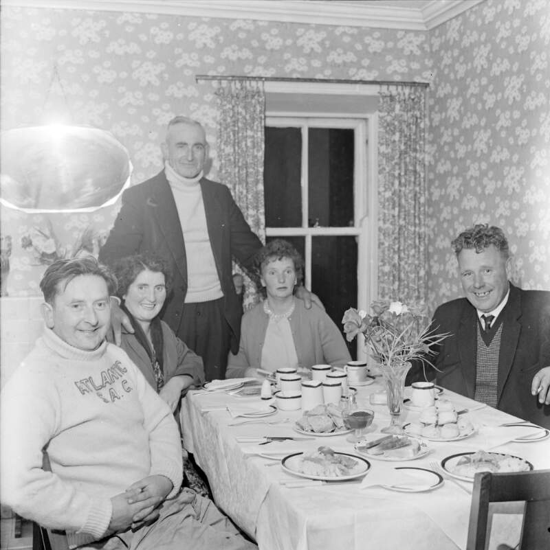 [Anglers sitting at table about to eat in Rosbeg, Co. Donegal]